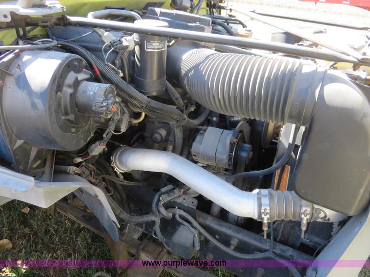 image for item L2424 1994 Ford F700 flatbed truck