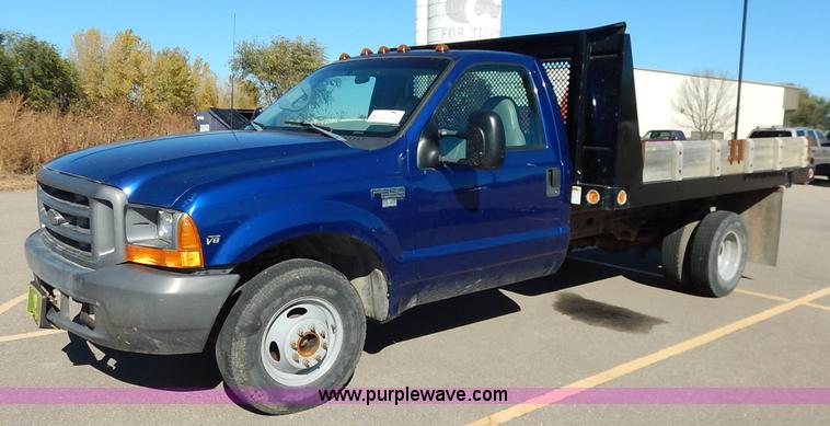 image for item L3546 1999 Ford F350 Super Duty XL flatbed pickup truck