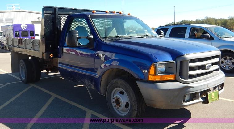 image for item L3546 1999 Ford F350 Super Duty XL flatbed pickup truck