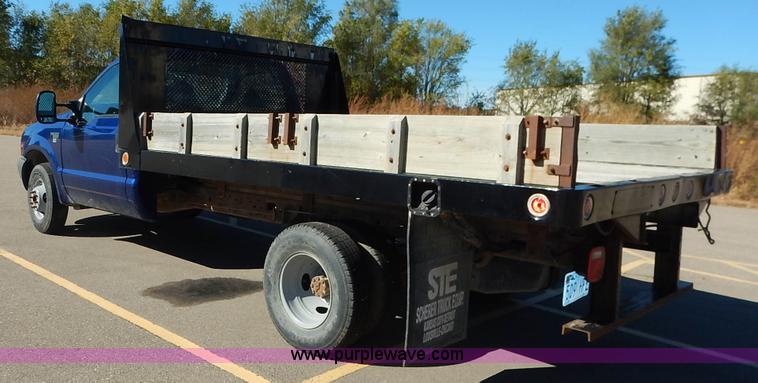 image for item L3546 1999 Ford F350 Super Duty XL flatbed pickup truck