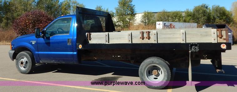 image for item L3546 1999 Ford F350 Super Duty XL flatbed pickup truck