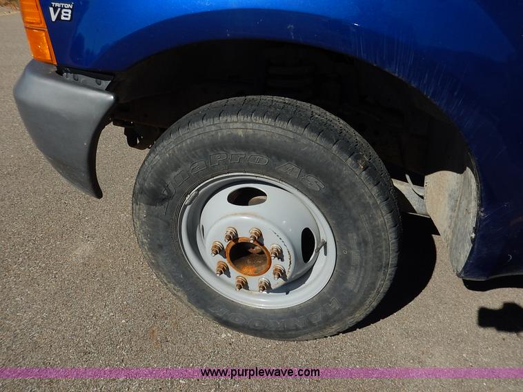 image for item L3546 1999 Ford F350 Super Duty XL flatbed pickup truck