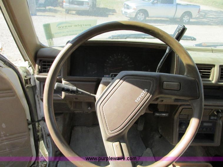 image for item R9490 1987 Toyota flatbed pickup truck