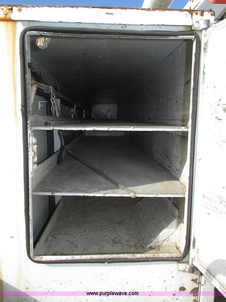 image for item H1112 2002 Altec utility bed with boom