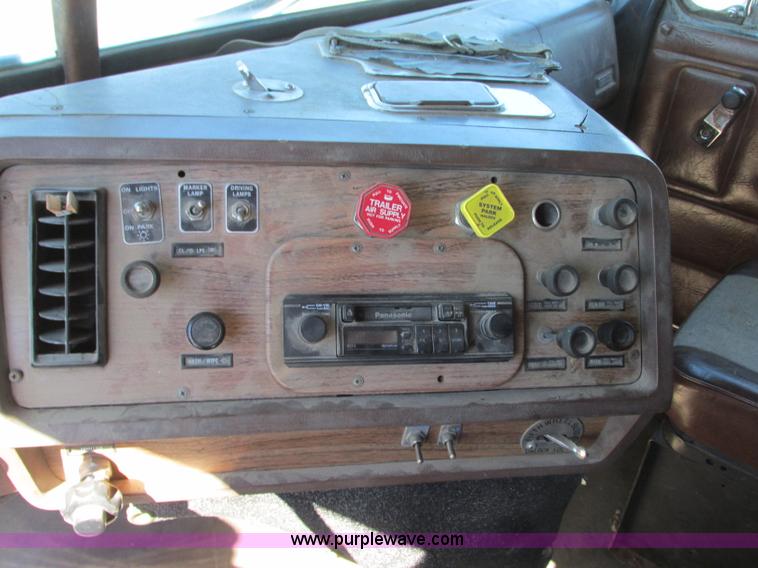 image for item J8726 1987 Volvo White WIM semi truck