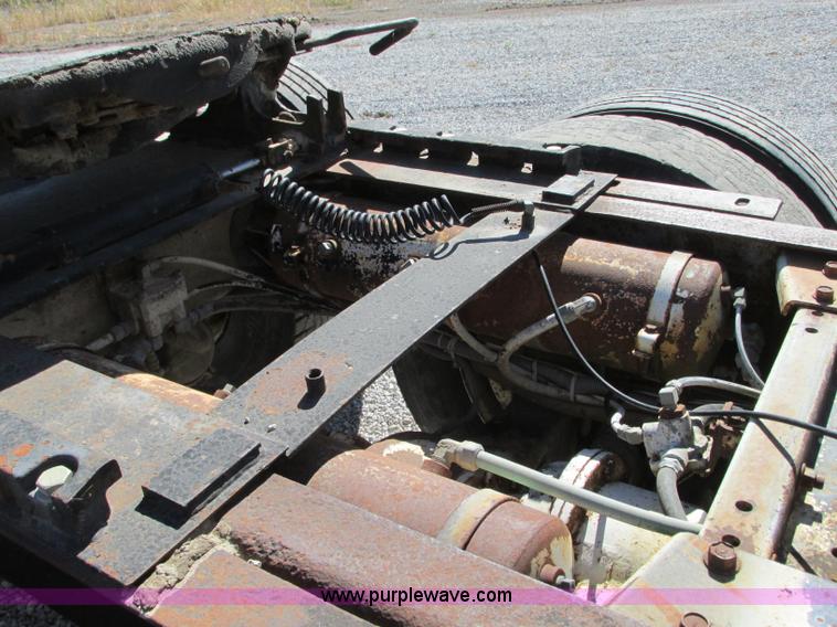 image for item J8726 1987 Volvo White WIM semi truck