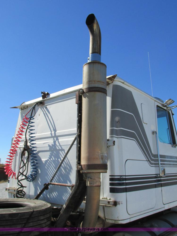 image for item J8726 1987 Volvo White WIM semi truck