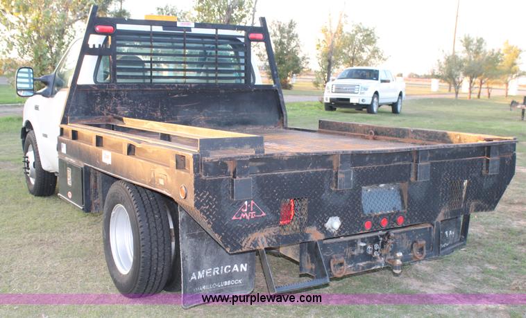 image for item J1394 2006 Ford F350 flatbed pickup truck