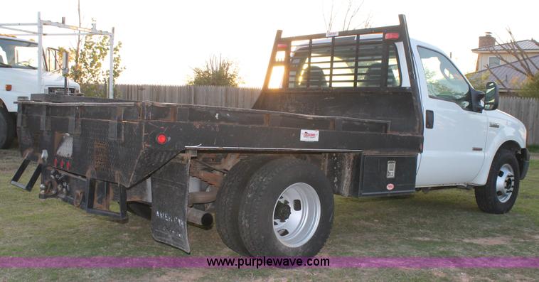 image for item J1394 2006 Ford F350 flatbed pickup truck