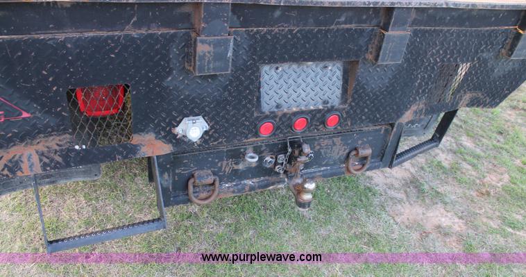 image for item J1394 2006 Ford F350 flatbed pickup truck