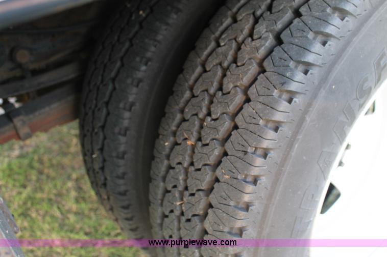 image for item J1394 2006 Ford F350 flatbed pickup truck