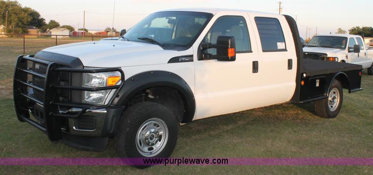 image for item J1396 2011 Ford F250 Crew Cab flatbed pickup truck