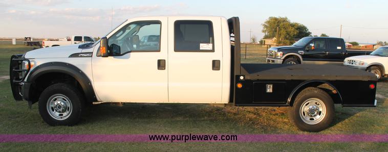 image for item J1396 2011 Ford F250 Crew Cab flatbed pickup truck