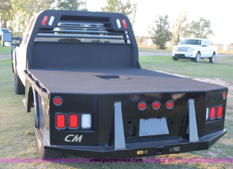 image for item J1396 2011 Ford F250 Crew Cab flatbed pickup truck