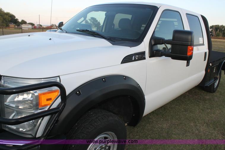 image for item J1396 2011 Ford F250 Crew Cab flatbed pickup truck