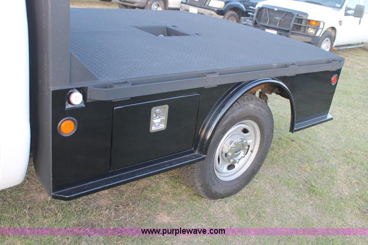 image for item J1396 2011 Ford F250 Crew Cab flatbed pickup truck