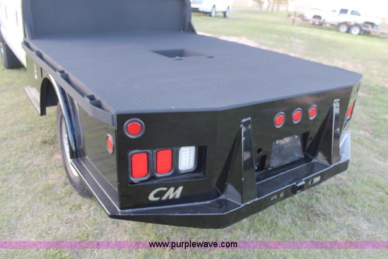 image for item J1396 2011 Ford F250 Crew Cab flatbed pickup truck