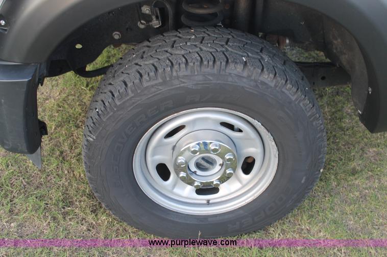 image for item J1396 2011 Ford F250 Crew Cab flatbed pickup truck