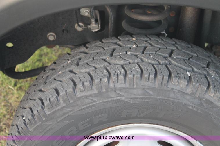 image for item J1396 2011 Ford F250 Crew Cab flatbed pickup truck