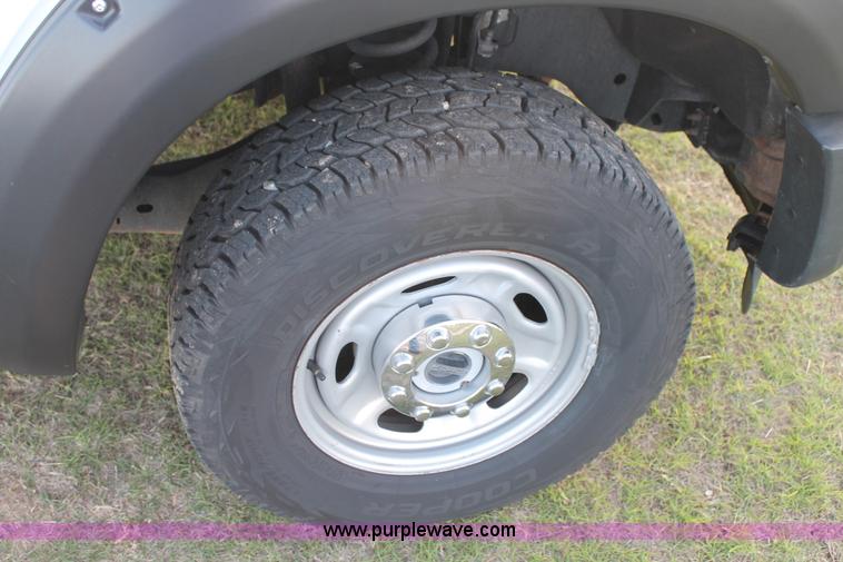 image for item J1396 2011 Ford F250 Crew Cab flatbed pickup truck