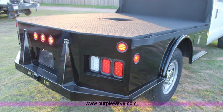 image for item J1396 2011 Ford F250 Crew Cab flatbed pickup truck