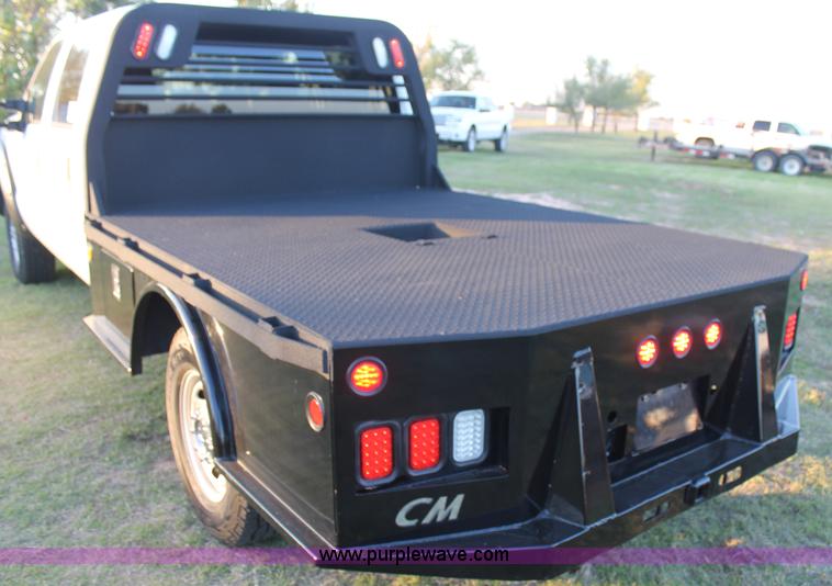 image for item J1396 2011 Ford F250 Crew Cab flatbed pickup truck