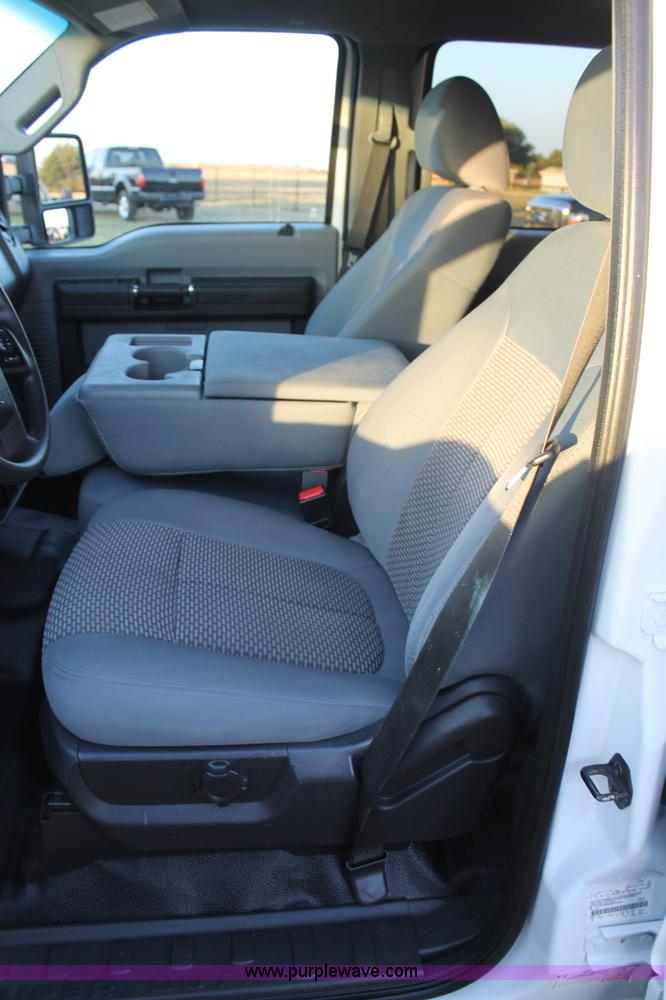 image for item J1396 2011 Ford F250 Crew Cab flatbed pickup truck