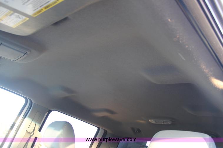 image for item J1396 2011 Ford F250 Crew Cab flatbed pickup truck