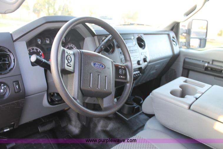 image for item J1396 2011 Ford F250 Crew Cab flatbed pickup truck