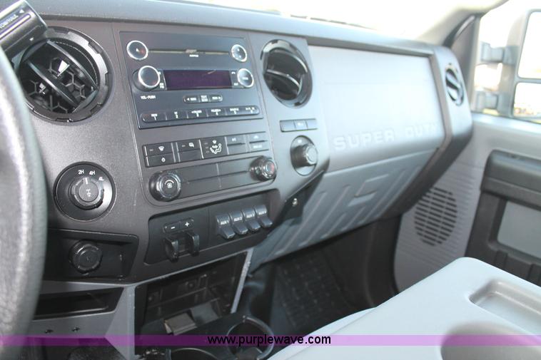 image for item J1396 2011 Ford F250 Crew Cab flatbed pickup truck