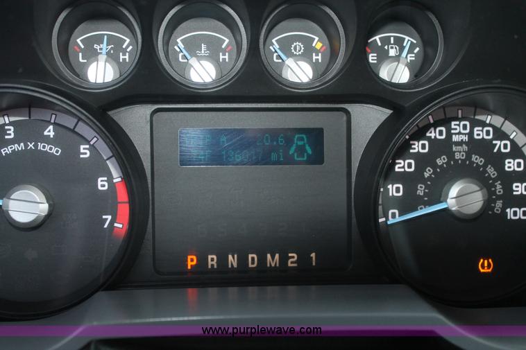 image for item J1396 2011 Ford F250 Crew Cab flatbed pickup truck