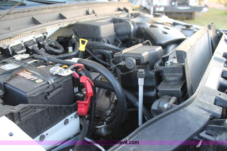 image for item J1396 2011 Ford F250 Crew Cab flatbed pickup truck