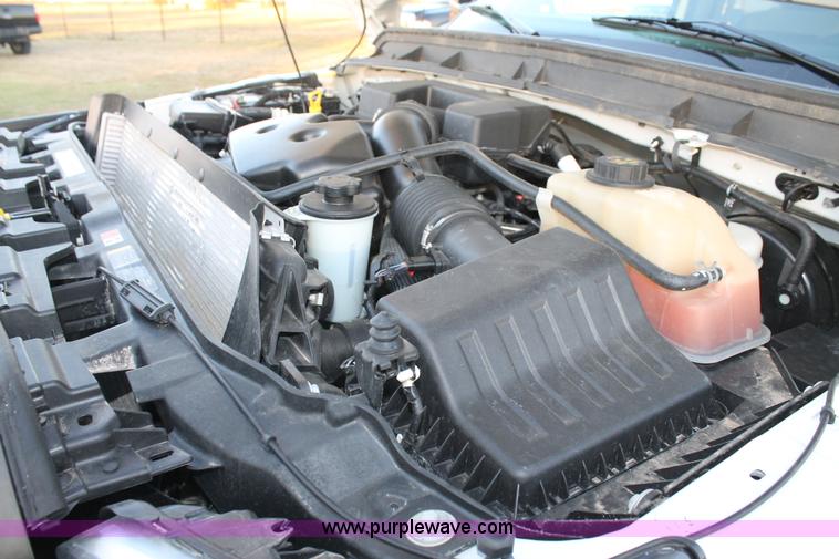 image for item J1396 2011 Ford F250 Crew Cab flatbed pickup truck