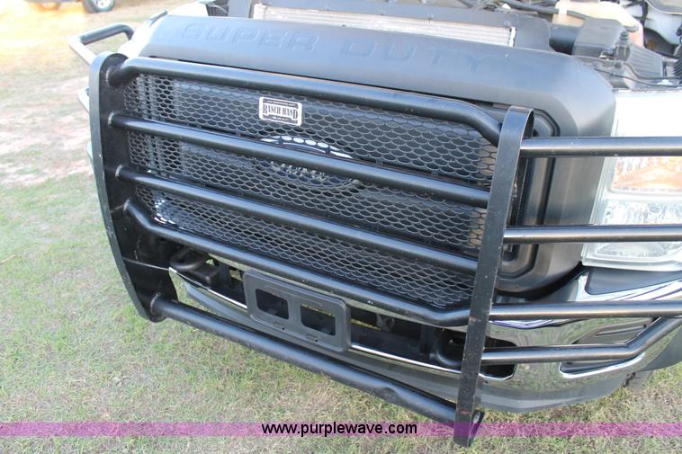 image for item J1396 2011 Ford F250 Crew Cab flatbed pickup truck