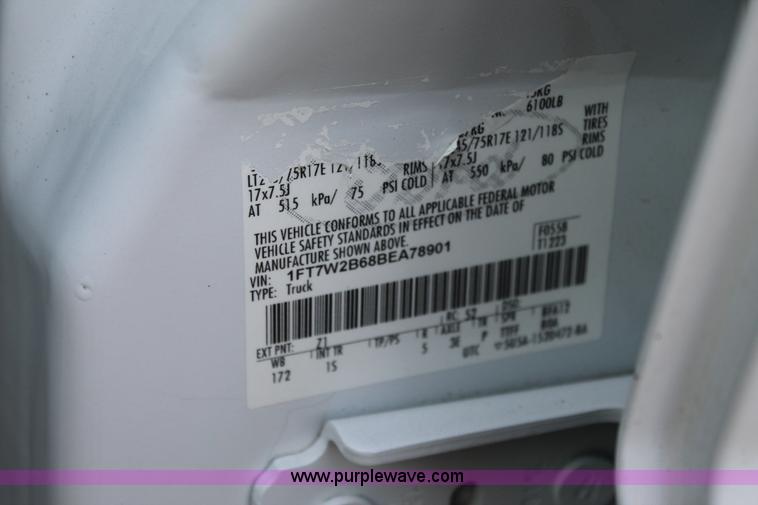 image for item J1396 2011 Ford F250 Crew Cab flatbed pickup truck