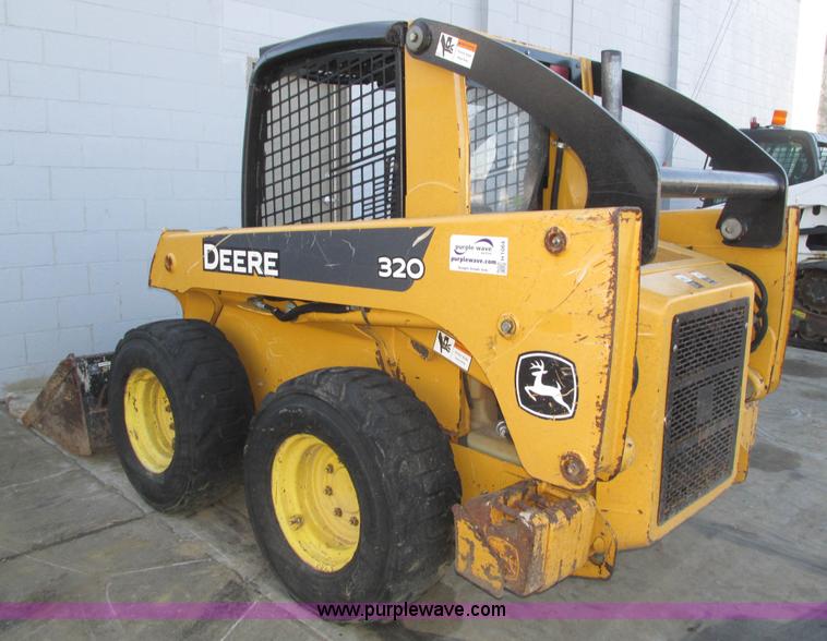 image for item H1064 2009 John Deere 320 skid steer