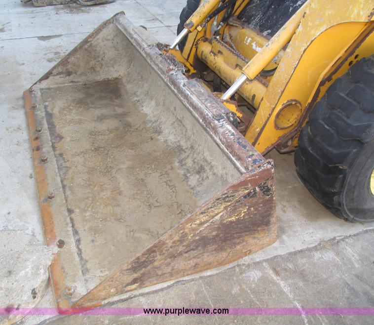 image for item H1064 2009 John Deere 320 skid steer