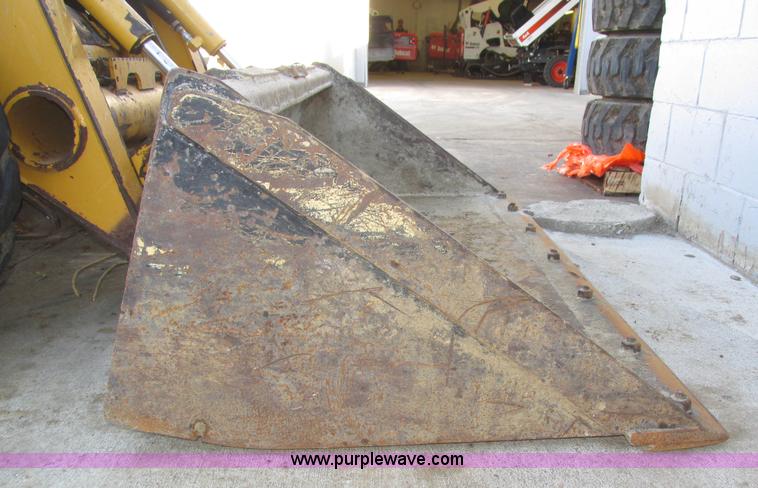 image for item H1064 2009 John Deere 320 skid steer