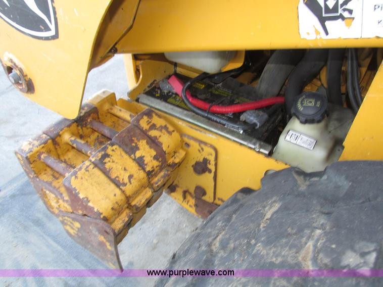 image for item H1064 2009 John Deere 320 skid steer
