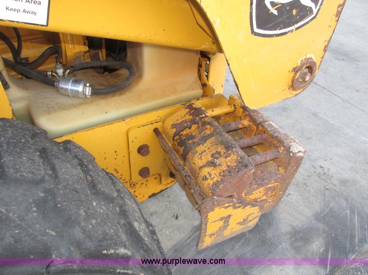 image for item H1064 2009 John Deere 320 skid steer