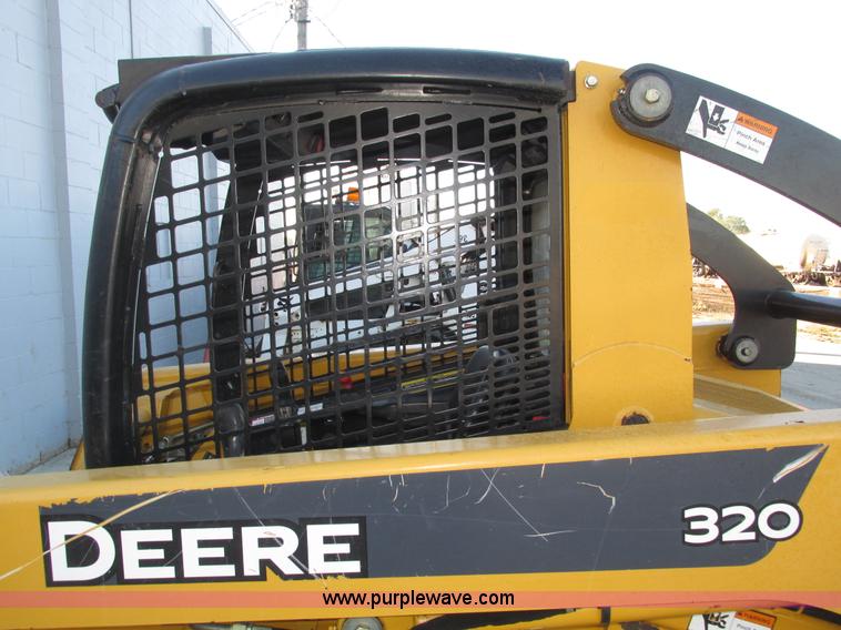 image for item H1064 2009 John Deere 320 skid steer