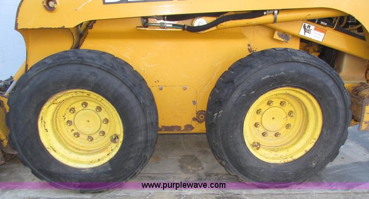image for item H1064 2009 John Deere 320 skid steer