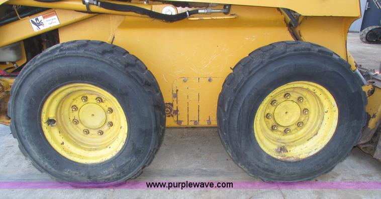 image for item H1064 2009 John Deere 320 skid steer
