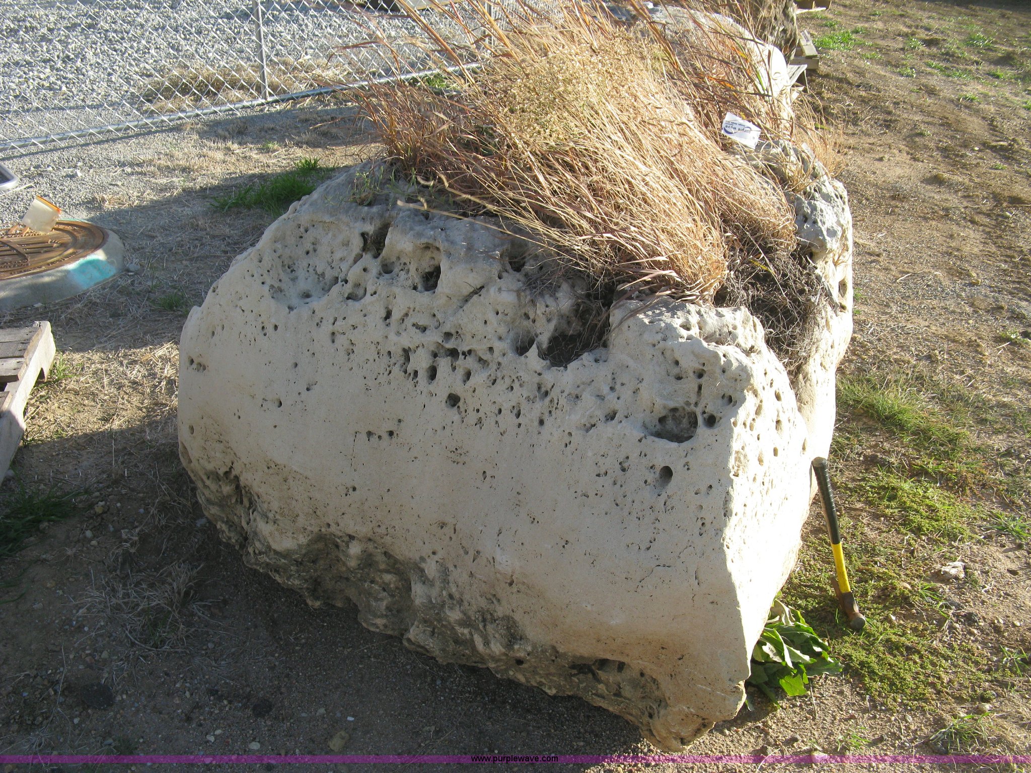 Holey limestone boulder in Wichita, KS | Item AL9438 sold | Purple Wave