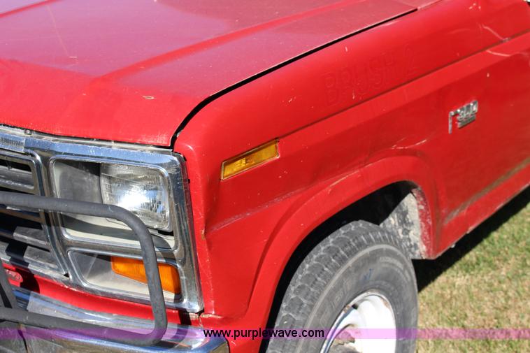 image for item J7499 1984 Ford F350 flatbed pickup truck