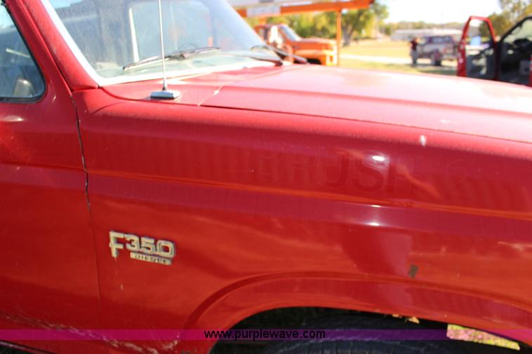 image for item J7499 1984 Ford F350 flatbed pickup truck