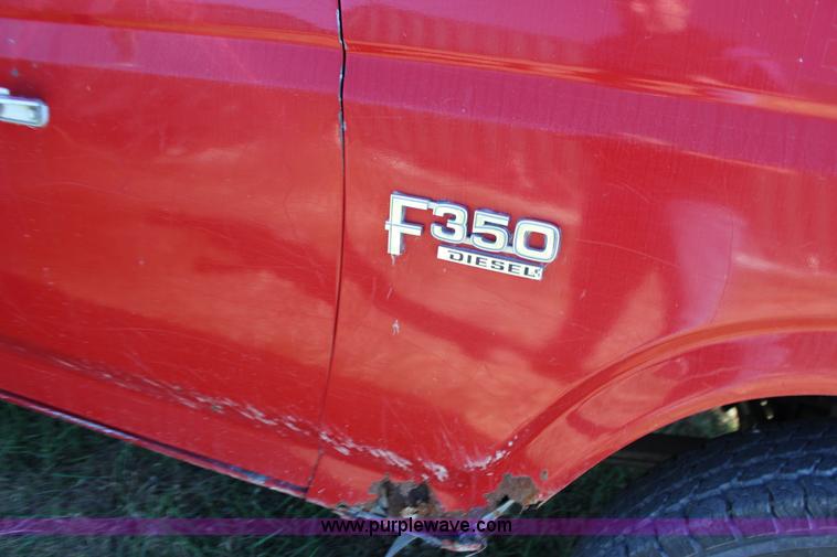 image for item J7499 1984 Ford F350 flatbed pickup truck