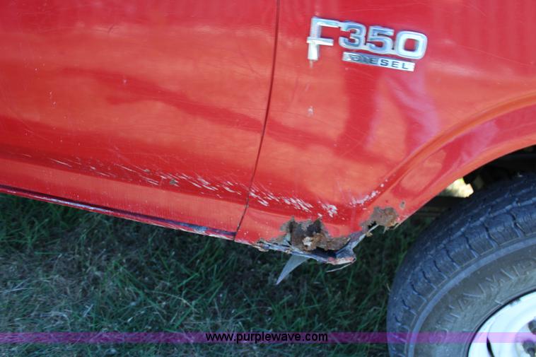 image for item J7499 1984 Ford F350 flatbed pickup truck