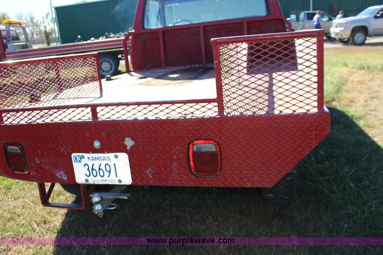 image for item J7499 1984 Ford F350 flatbed pickup truck