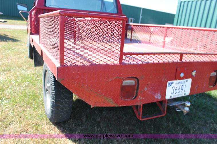 image for item J7499 1984 Ford F350 flatbed pickup truck